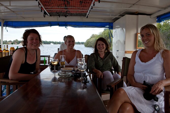 Guided Falls Tour & Zambezi River Cruise Combo - Monkeys, baboons, and the border setting