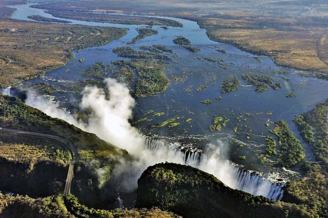 Victoria Falls Guided Tour with Hotel Pickup - Reaching Victoria Falls Bridge between Zimbabwe and Zambia