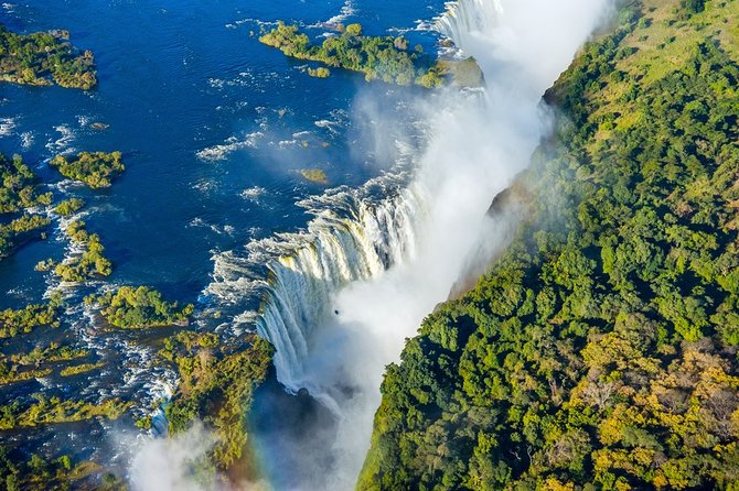 Victoria Falls Guided Tour with Hotel Pickup - What the guide adds to the experience