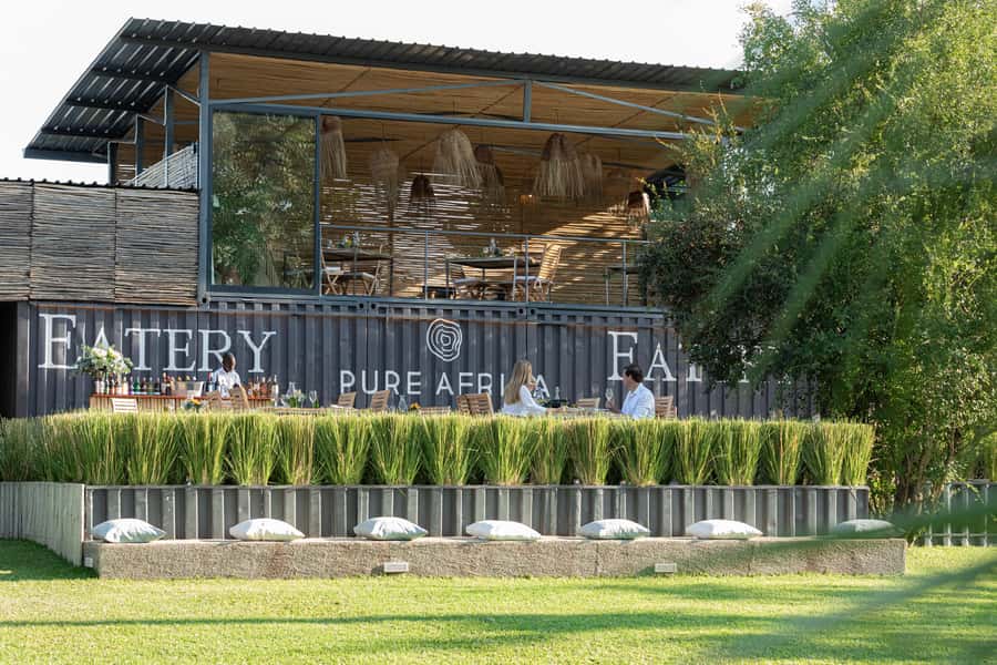 Victoria Falls: The Eatery Lunch Experience - Settling under the trees and umbrellas