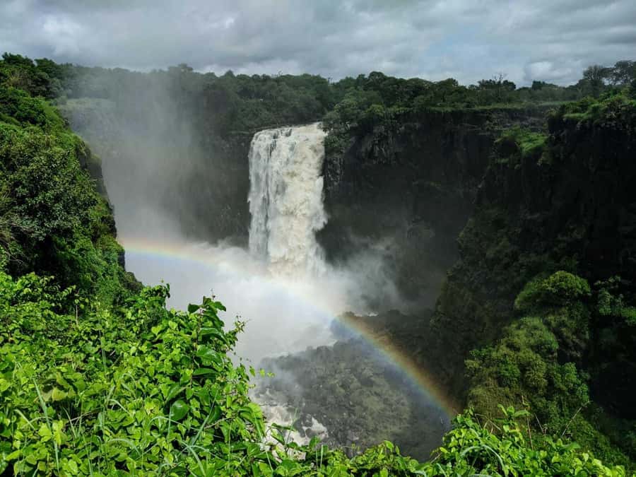 Victoria Falls Town: Victoria Falls Guided Sunrise Tour - Walking through the falls at first light